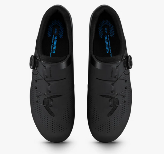 A pair of Shimano road cycling shoes in matte black, shown from a top-down view on a light gray background.