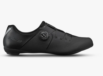 A black shimano cycling shoe with a dial closure system and perforated side panels, shown in profile against a light gray background.