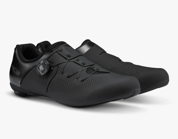 A pair of shimano rc3 black cycling shoes with perforated uppers and a dial closure system, shown on a light gray background.