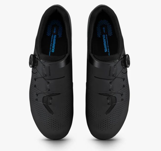 A pair of Shimano road cycling shoes in matte black, shown from a top-down view on a light gray background.