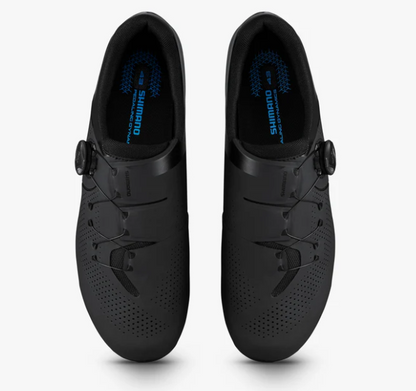 A pair of Shimano road cycling shoes in matte black, shown from a top-down view on a light gray background.